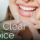smiling female holding clear aligners
