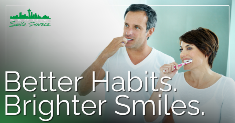 Man and woman brushing their teeth